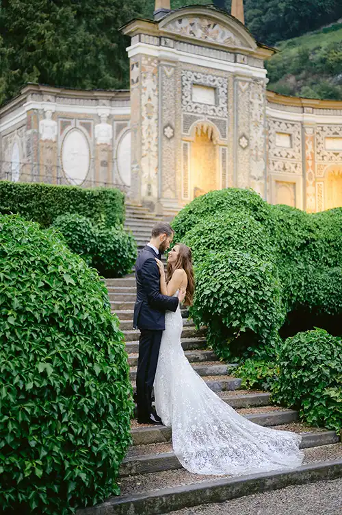 Bride and groom on the garden steps of Villa d’Este during a wedding on Lake Como.