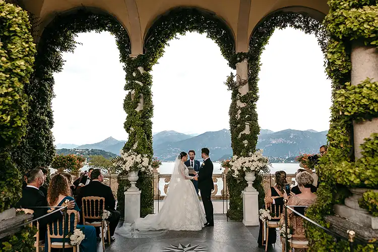 Wedding ceremony at Villa del Balbianello on Lake Como under the historic loggia.