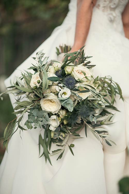 Country chic bouquet made up of olive leaves and white flowers
