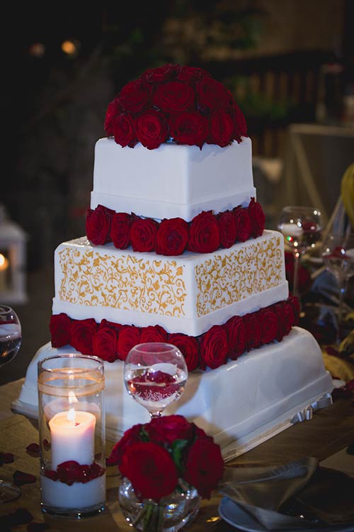Wedding cake was white and red perfectly following the theme of the wedding
