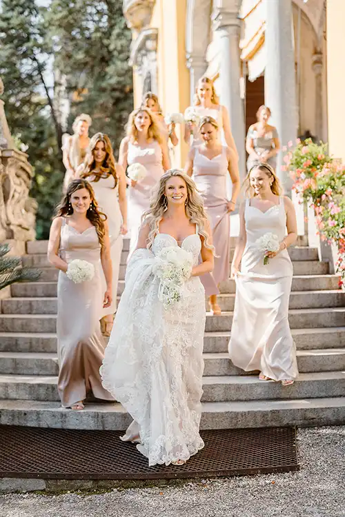Bride and bridesmaids walking down the steps of an elegant villa during a wedding on Lake Maggiore