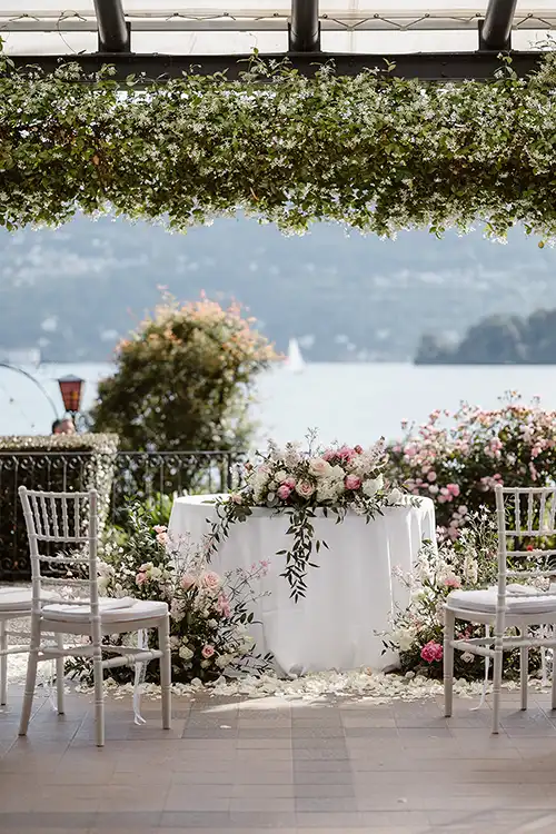 Symbolic wedding ceremony setup with floral decor and lake views on Lake Maggiore