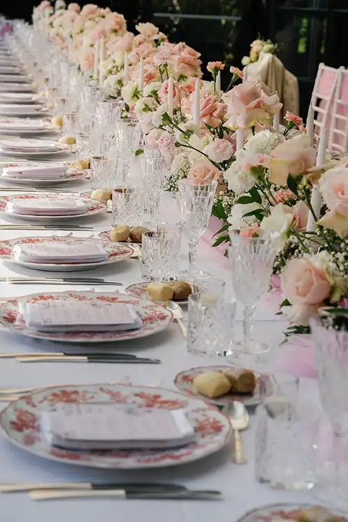 Elegant wedding table setting with pink floral arrangements on Lake Maggiore
