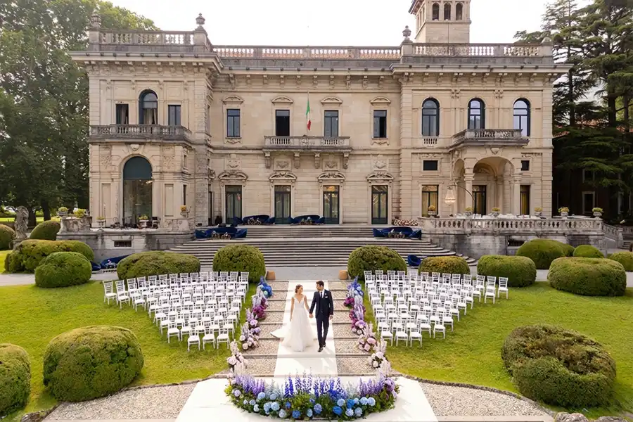 Elegant ceremony setup in front of a historic Villa Erba for a luxury wedding on Lake Como.