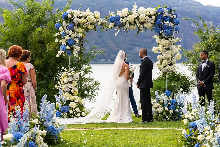 An outdoor ceremony with lake views for a beautifully designed luxury wedding on Lake Como.
