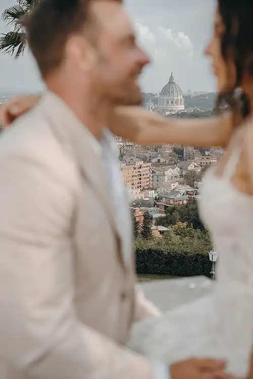 Couple with panoramic view of Rome and St. Peter’s Basilica in the background.