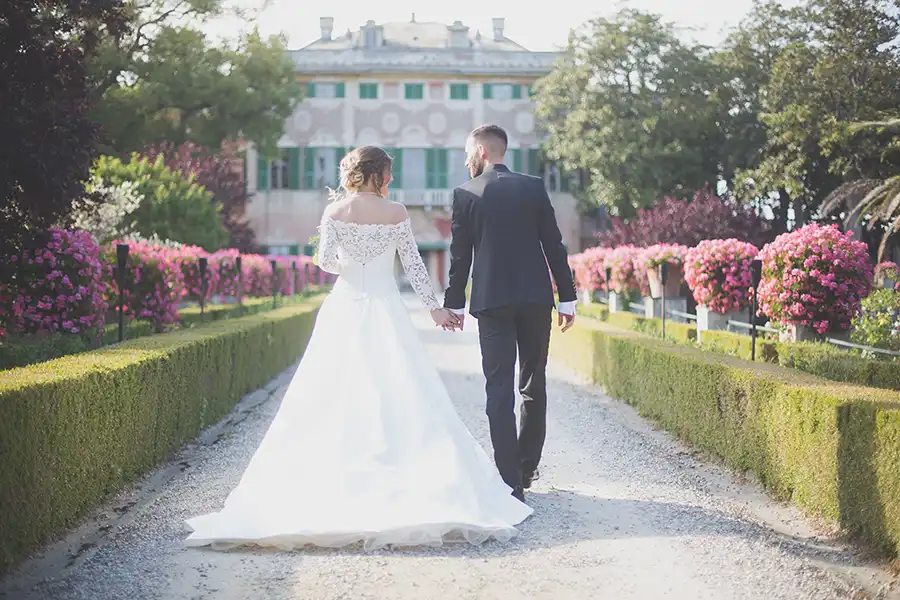 Bride and groom walking through the gardens of Villa Faraggiana during a wedding on the Italian Riviera