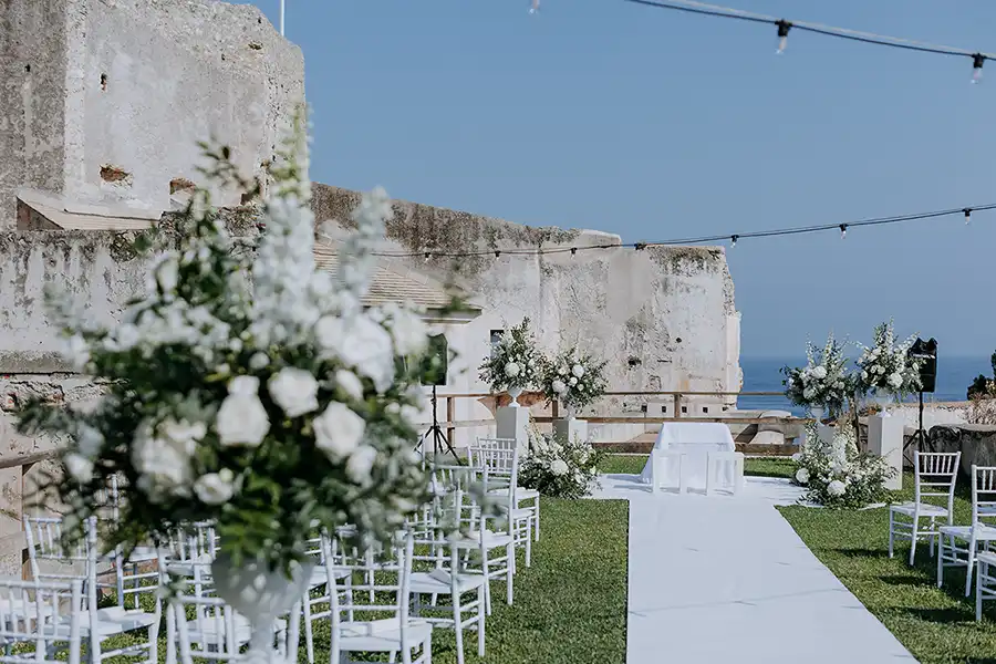 Outdoor wedding ceremony in a historic seaside venue on the Italian Riviera