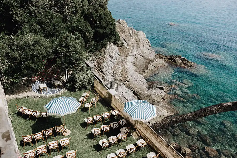 Seaside wedding ceremony setup on a cliff overlooking the Italian Riviera