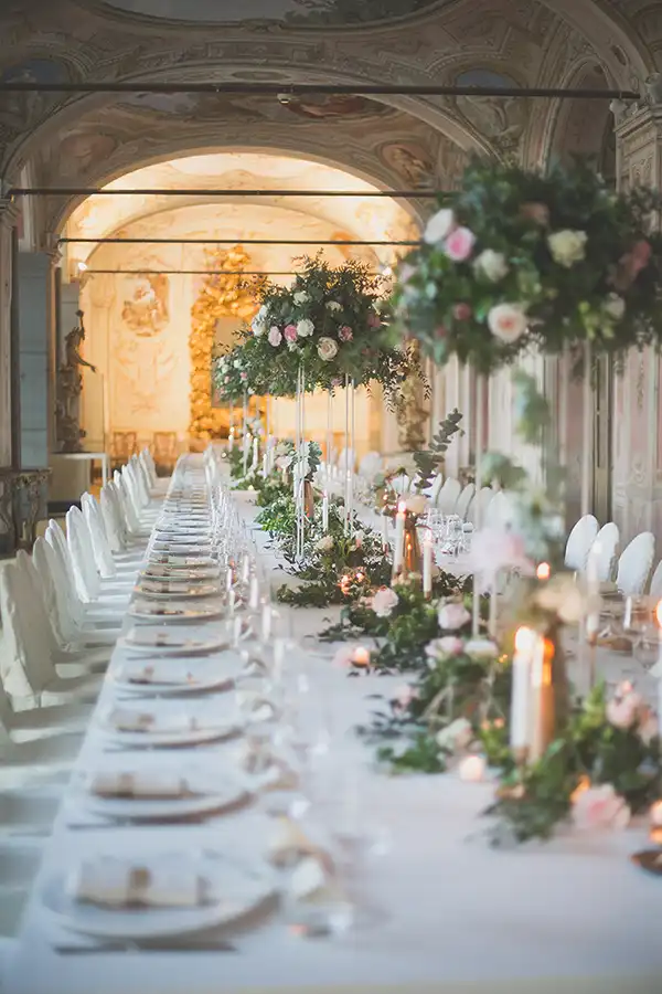 Long wedding reception table in an elegant historic venue on the Italian Riviera