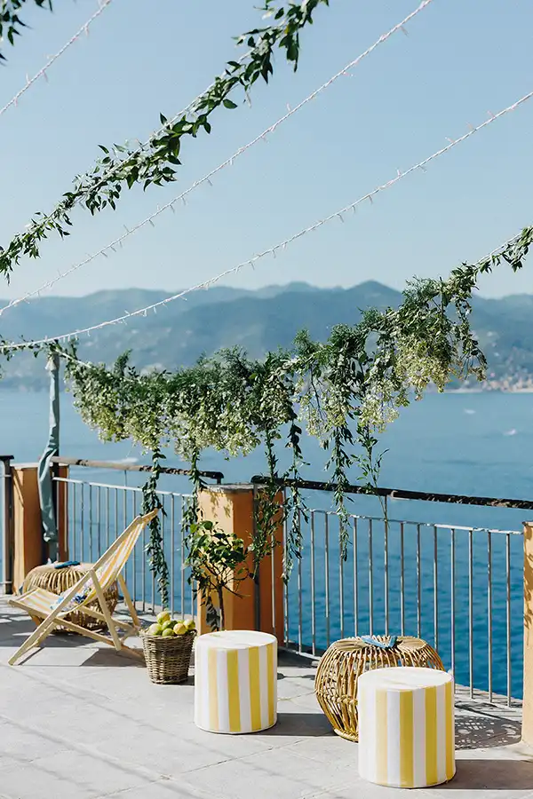 Seaside wedding lounge setup on a terrace overlooking the Italian Riviera