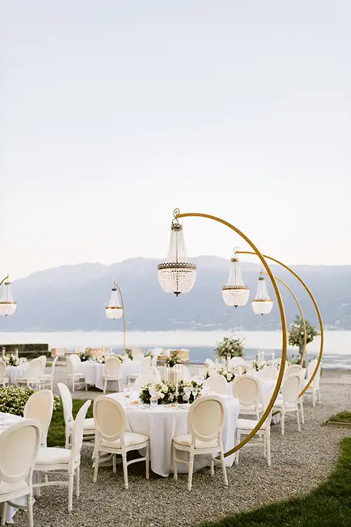 Outdoor wedding reception setup with lake views on Lake Garda