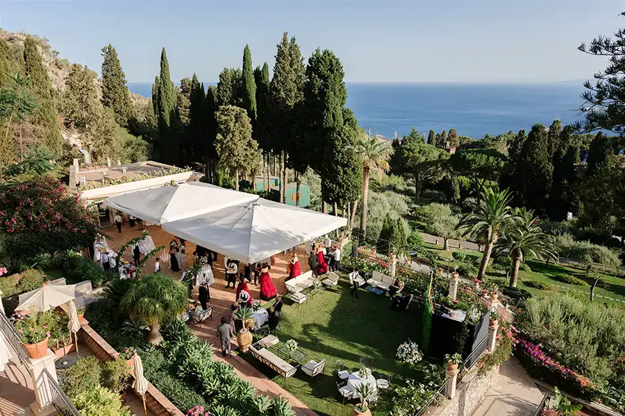 A garden wedding reception with open views over the Sicilian sea
