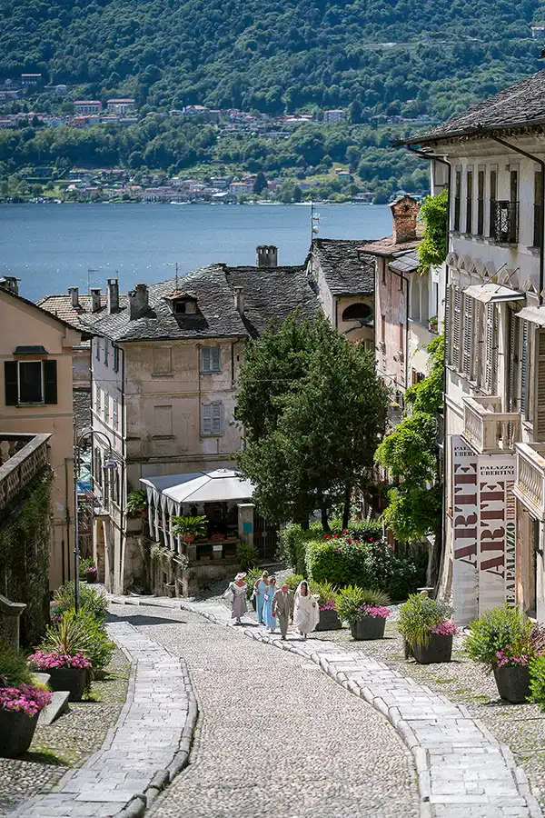 Bride walking up Salita della Motta in Orta San Giulio before the wedding ceremony