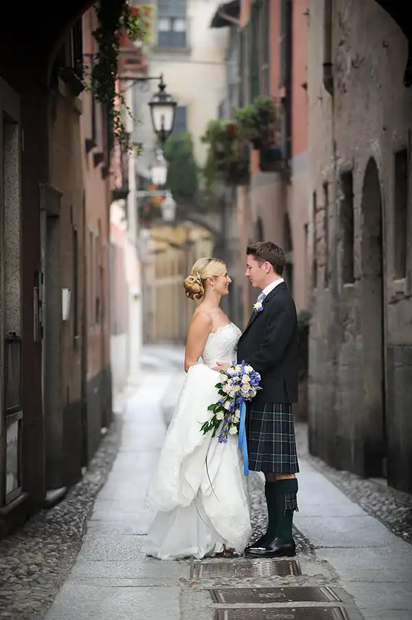Bride and groom in a historic alley in Orta San Giulio