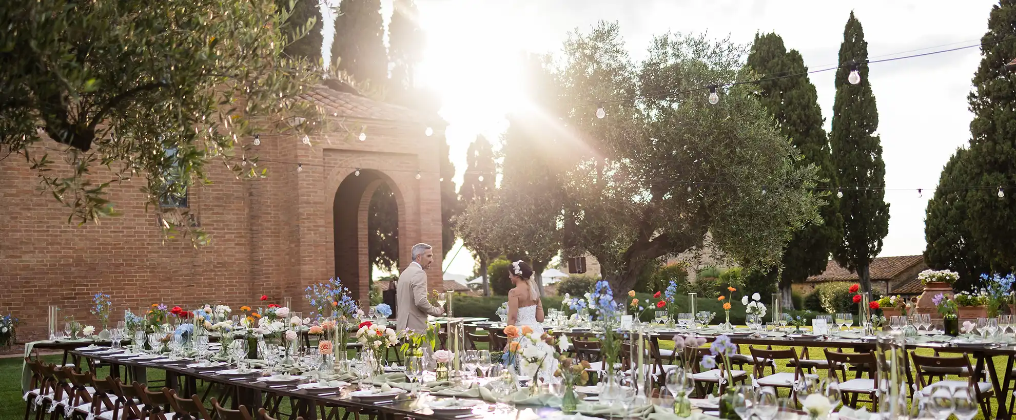 Outdoor wedding reception at a historic country estate in Tuscany