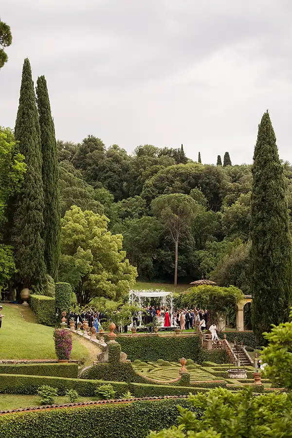 Outdoor wedding ceremony in the gardens of a Tuscan villa
