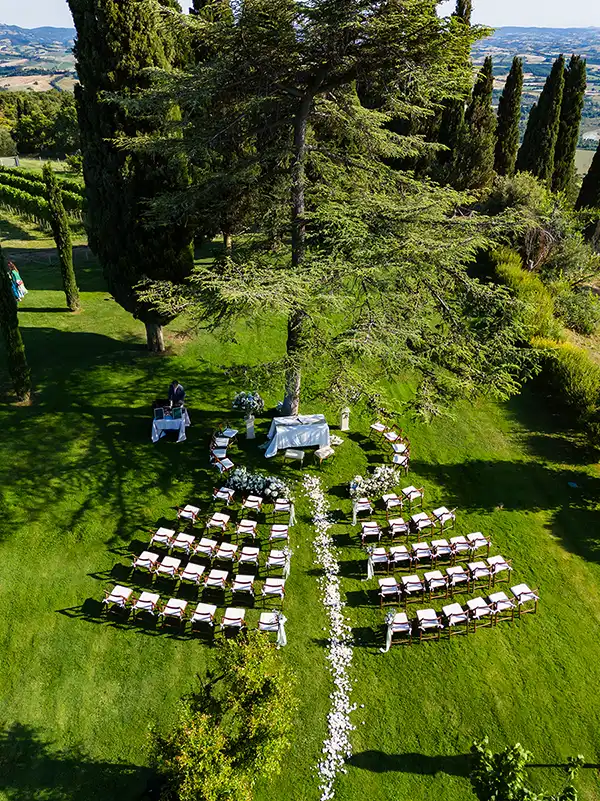 Outdoor wedding ceremony at a historic estate in Tuscany